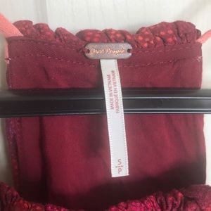 Red patterned free people shirt size s